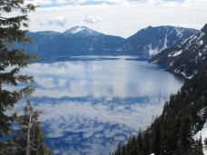 Clouds reflect on Crater Lake